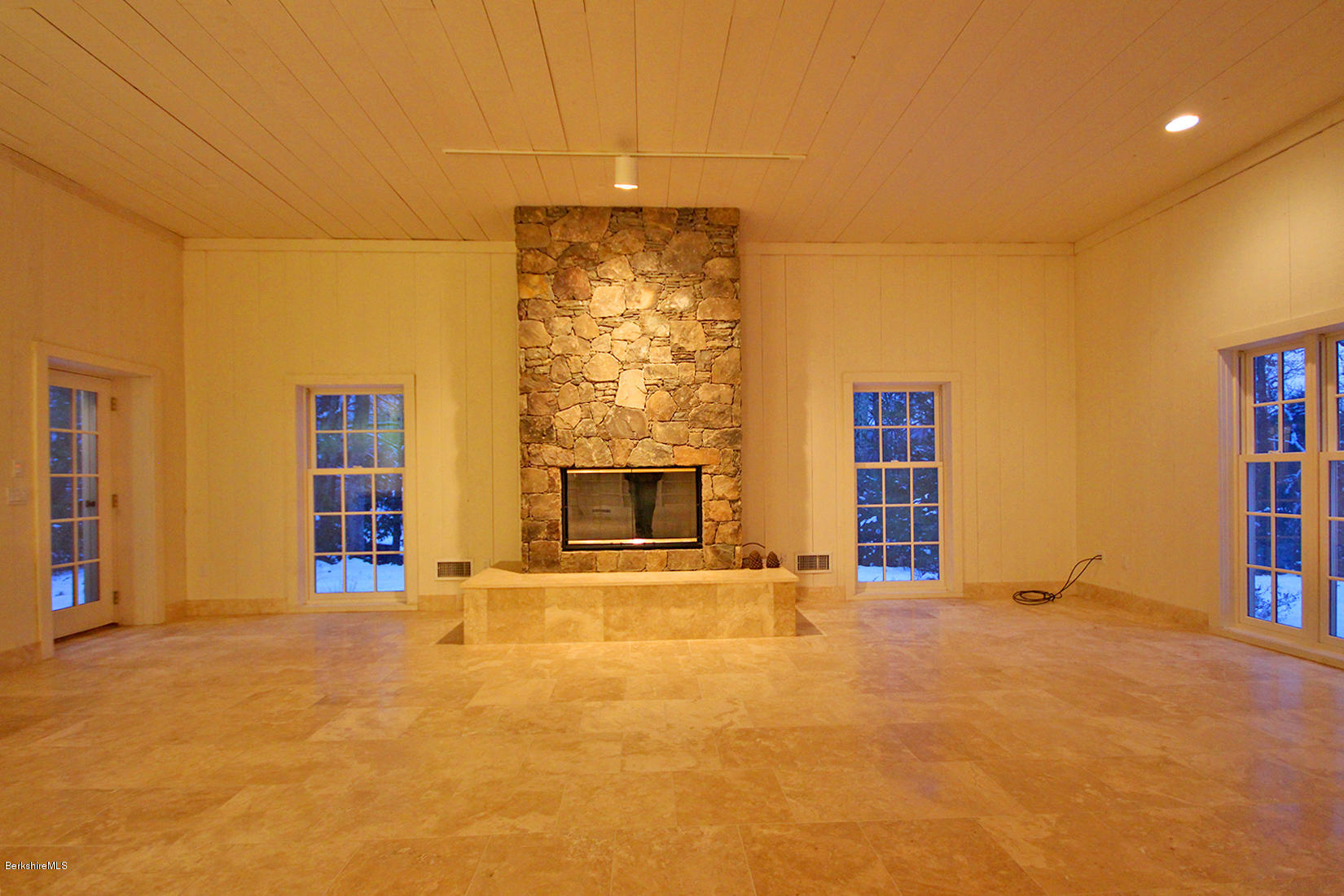 315 Canaan Road Sheffield, MA 01222 - Photo 10 of 40 a view of an empty room with a fireplace
