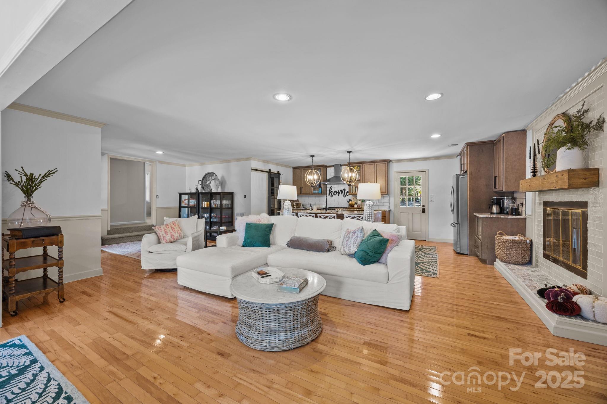 255 Topsail Road Salisbury, NC 28146 - Photo 12 of 47 a living room with furniture and a wooden floor