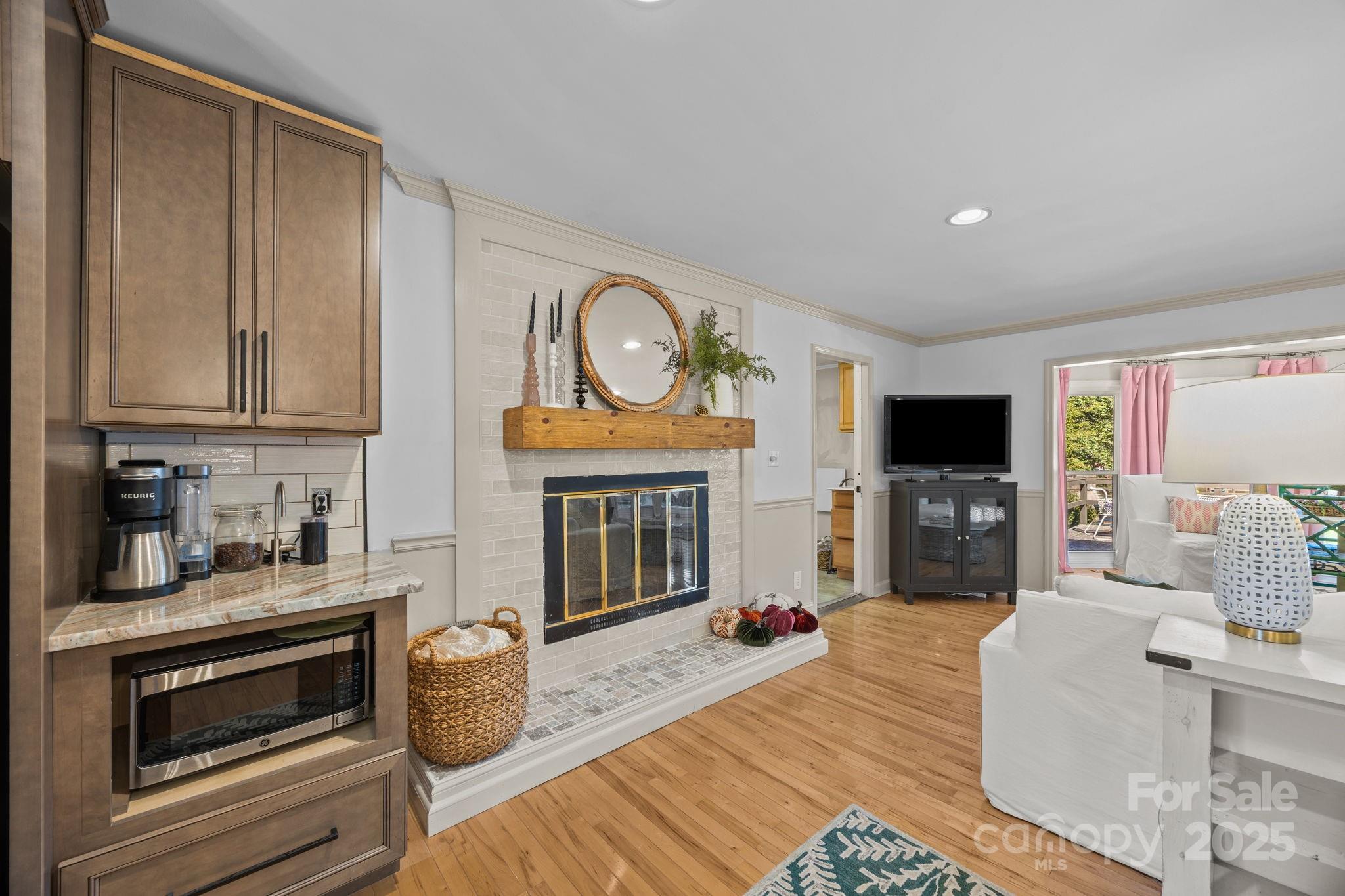 255 Topsail Road Salisbury, NC 28146 - Photo 15 of 47 a living room with furniture a fireplace and a flat screen tv