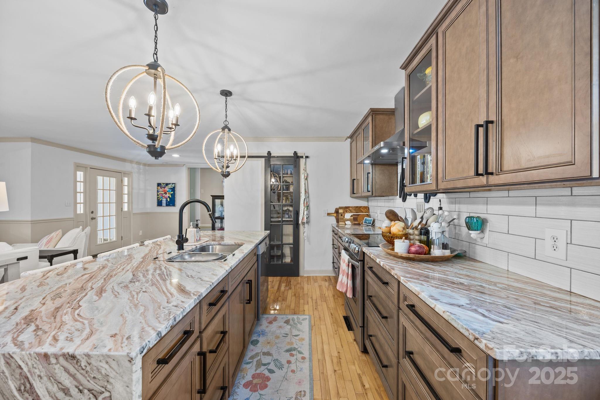 255 Topsail Road Salisbury, NC 28146 - Photo 18 of 47 a kitchen with stainless steel appliances granite countertop a sink a stove oven a counter space and cabinets