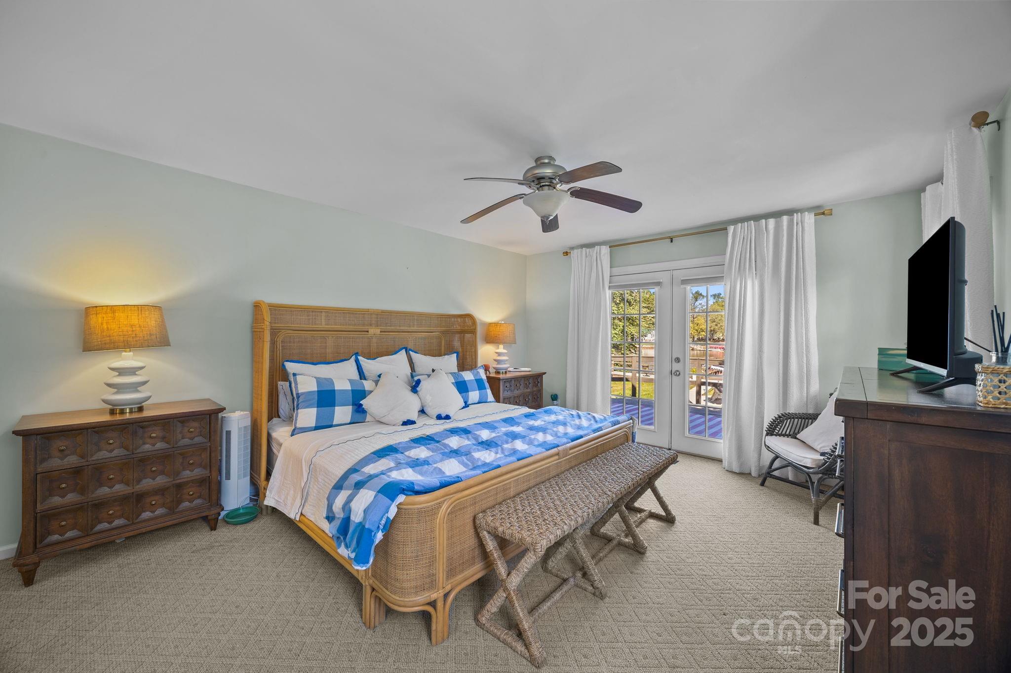 255 Topsail Road Salisbury, NC 28146 - Photo 28 of 47 a bedroom with a bed and a flat screen tv