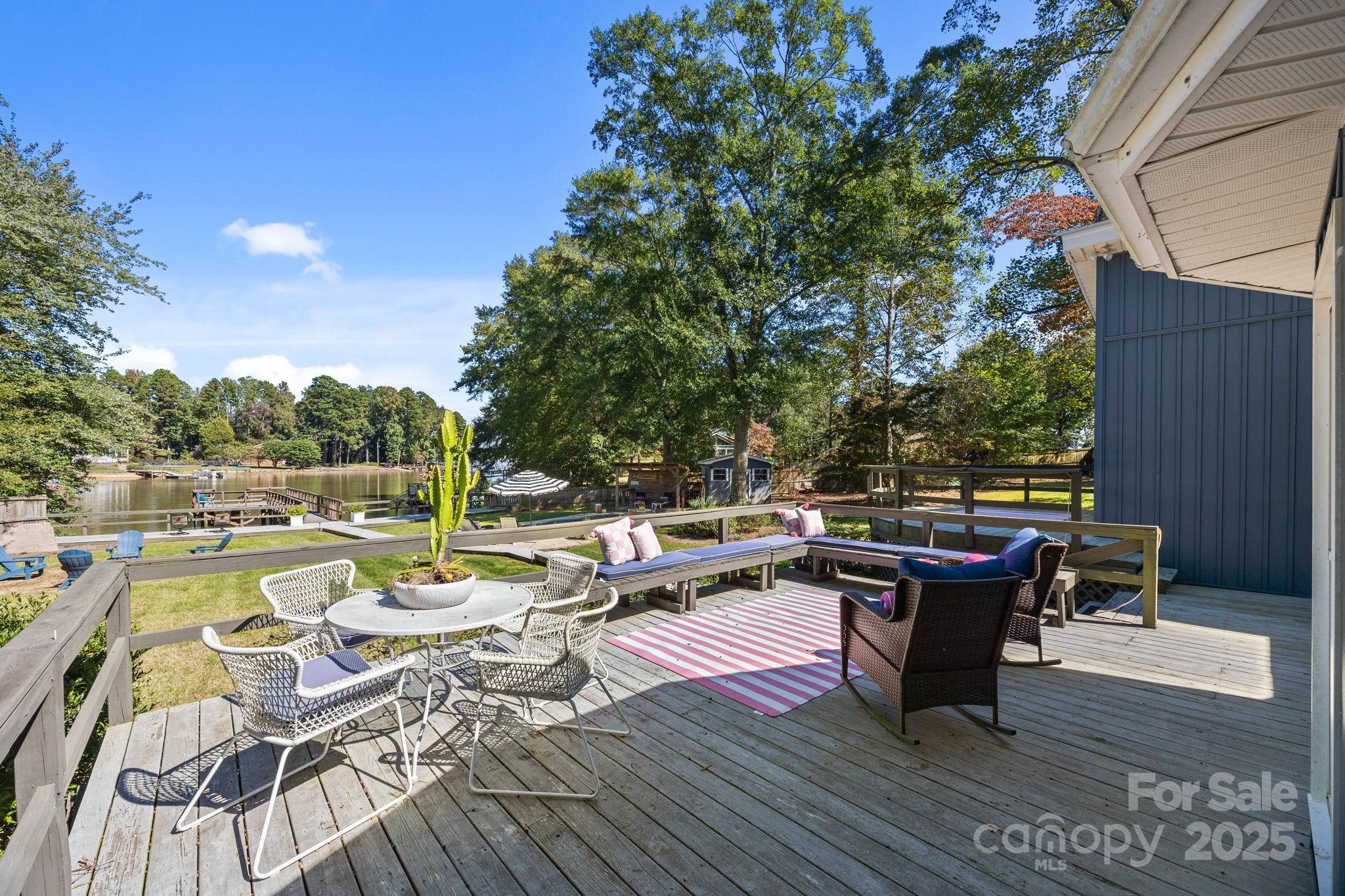 255 Topsail Road Salisbury, NC 28146 - Photo 32 of 47 a view of a roof deck with lawn chairs wooden floor and fence