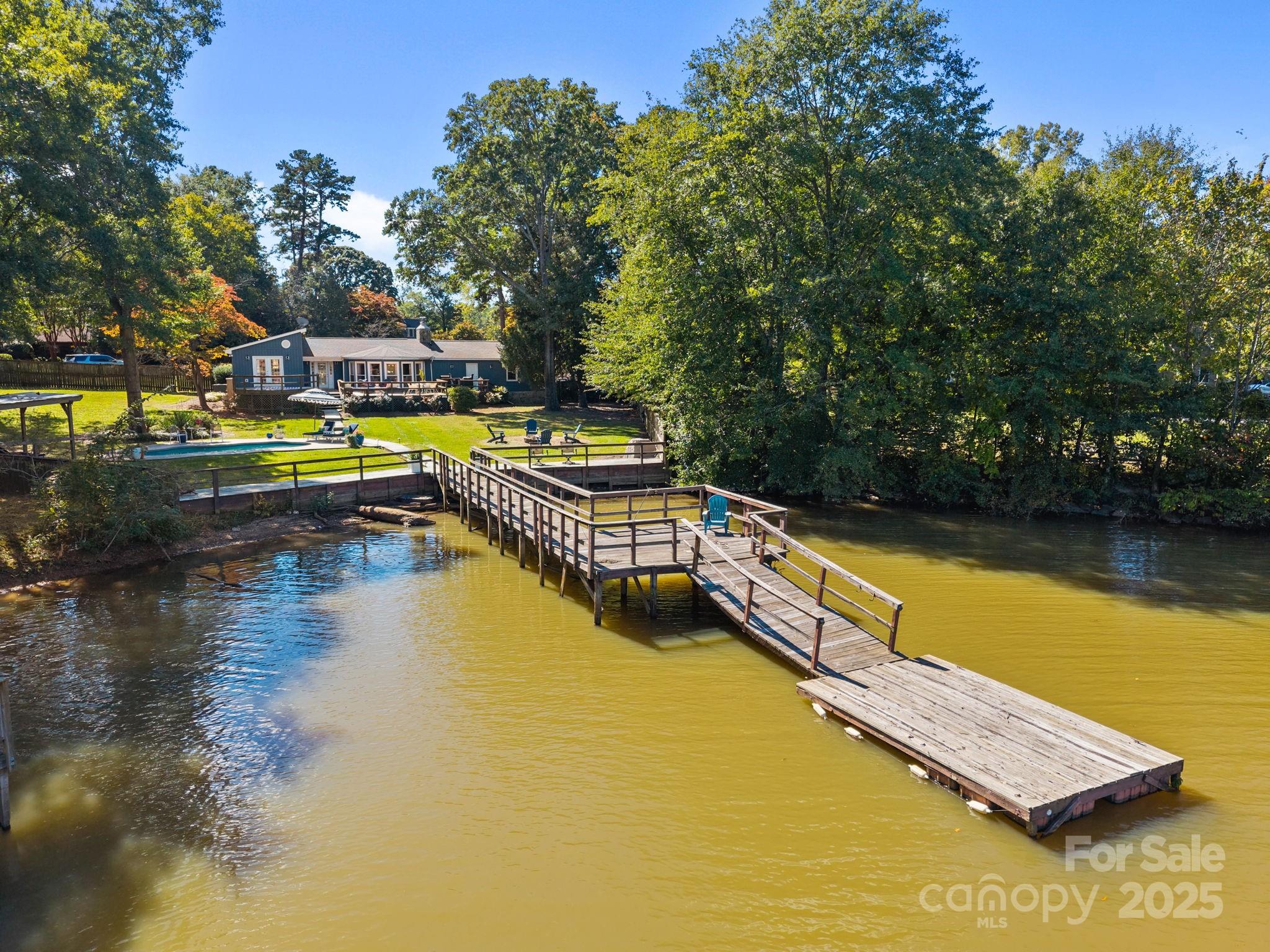 255 Topsail Road Salisbury, NC 28146 - Photo 46 of 47 a view of a swimming pool with an outdoor seating and a yard