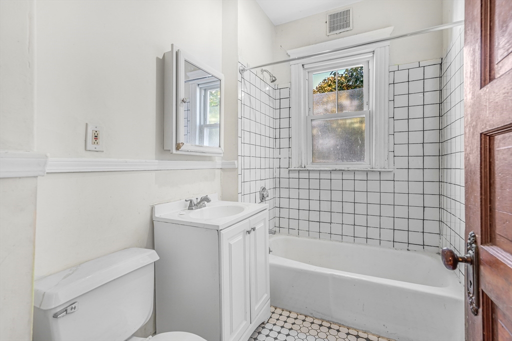 36 Mt Ida Road, Unit 3 Boston, MA 02122 - Photo 12 of 20 a bathroom with a sink a toilet and shower