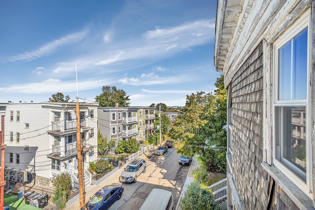 36 Mt Ida Road, Unit 3 Boston, MA 02122 - Photo 19 of 20 a view of a city with tall buildings