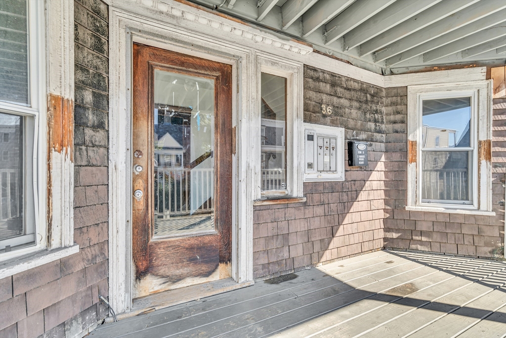 36 Mt Ida Road, Unit 3 Boston, MA 02122 - Photo 2 of 20 a view of a brick house with a large windows