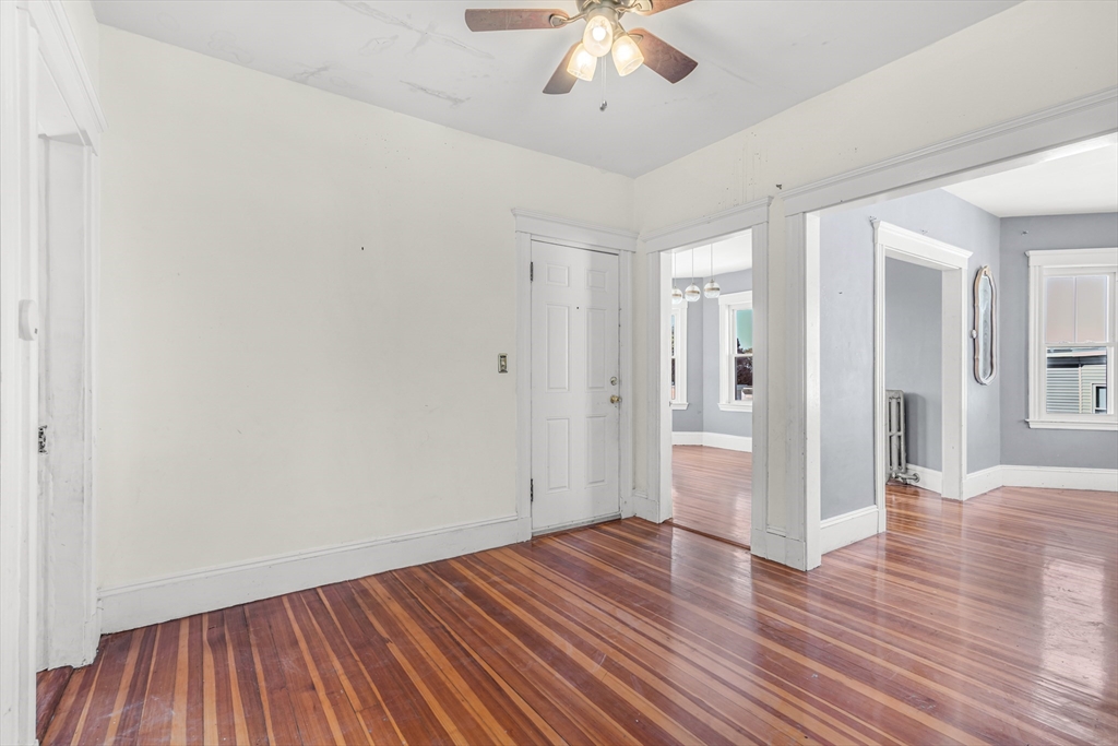36 Mt Ida Road, Unit 3 Boston, MA 02122 - Photo 3 of 20 wooden floor in an empty room with a window