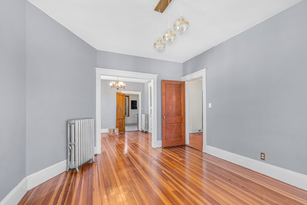 36 Mt Ida Road, Unit 3 Boston, MA 02122 - Photo 6 of 20 a view of a hallway with wooden floor