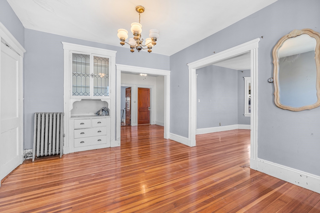 36 Mt Ida Road, Unit 3 Boston, MA 02122 - Photo 7 of 20 wooden floor with chandelier and wooden floor