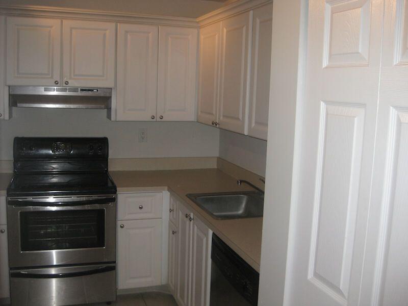 721 North Pine Island Road, Unit 116 Plantation, FL 33324 - Photo 2 of 23 a kitchen with granite countertop white cabinets and stainless steel appliances