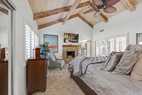 a bed room with a bed and a fireplace