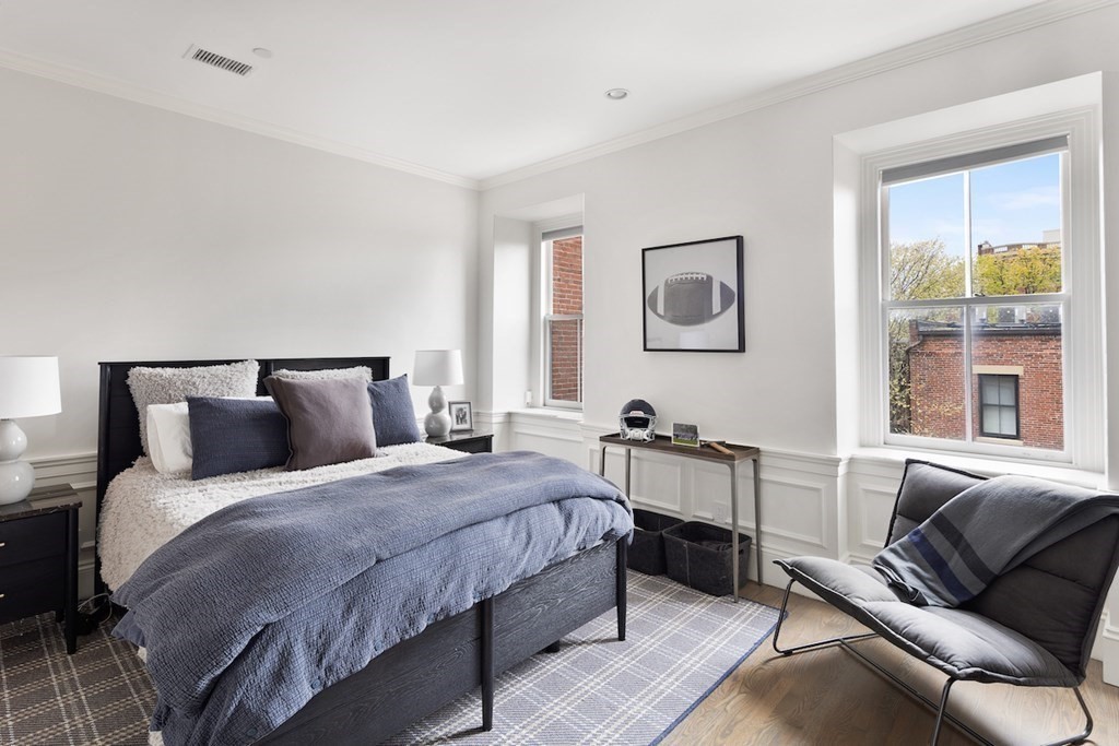 283 Commonwealth Avenue, Unit PH Boston, MA 02115 - Photo 15 of 18 a bedroom with a bed and a couch