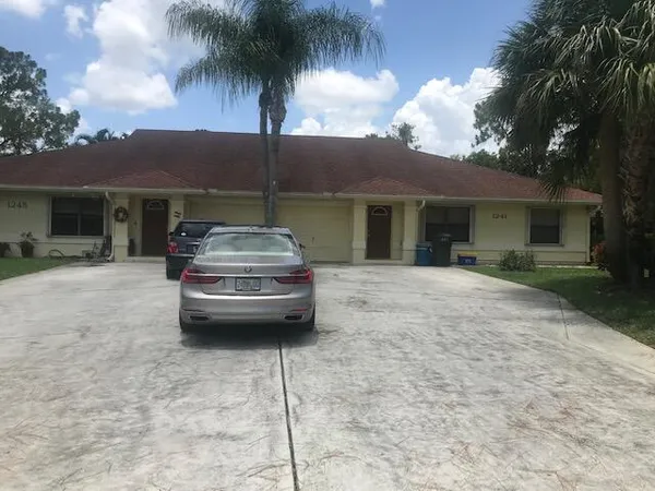 a view of a car parked in front of house