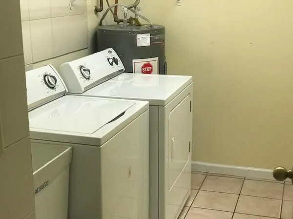 a utility room with dryer and washer