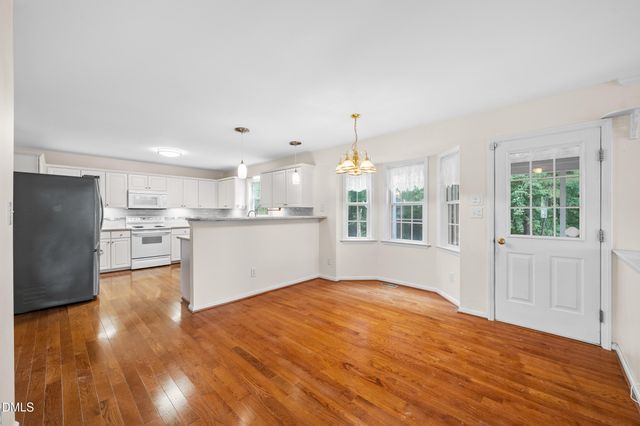 a view of kitchen with wooden floor