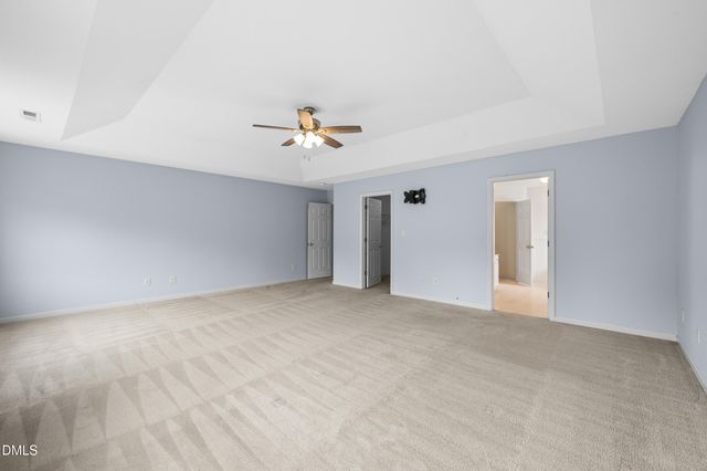 a view of an empty room with a bathroom
