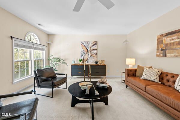 a living room with furniture and a window