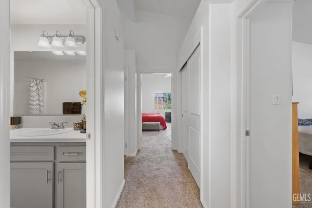 a en suite bathroom with a sink and mirror