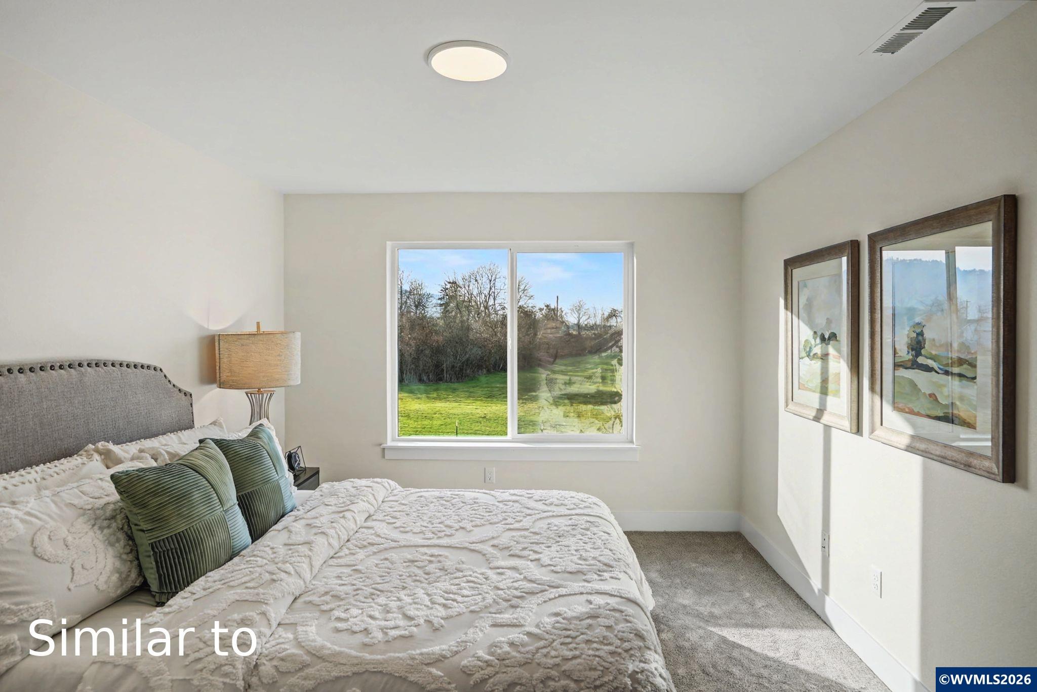 2550 Promise Way Lebanon, OR 97355 - Photo 19 of 35 a bed sitting in a bedroom next to a window