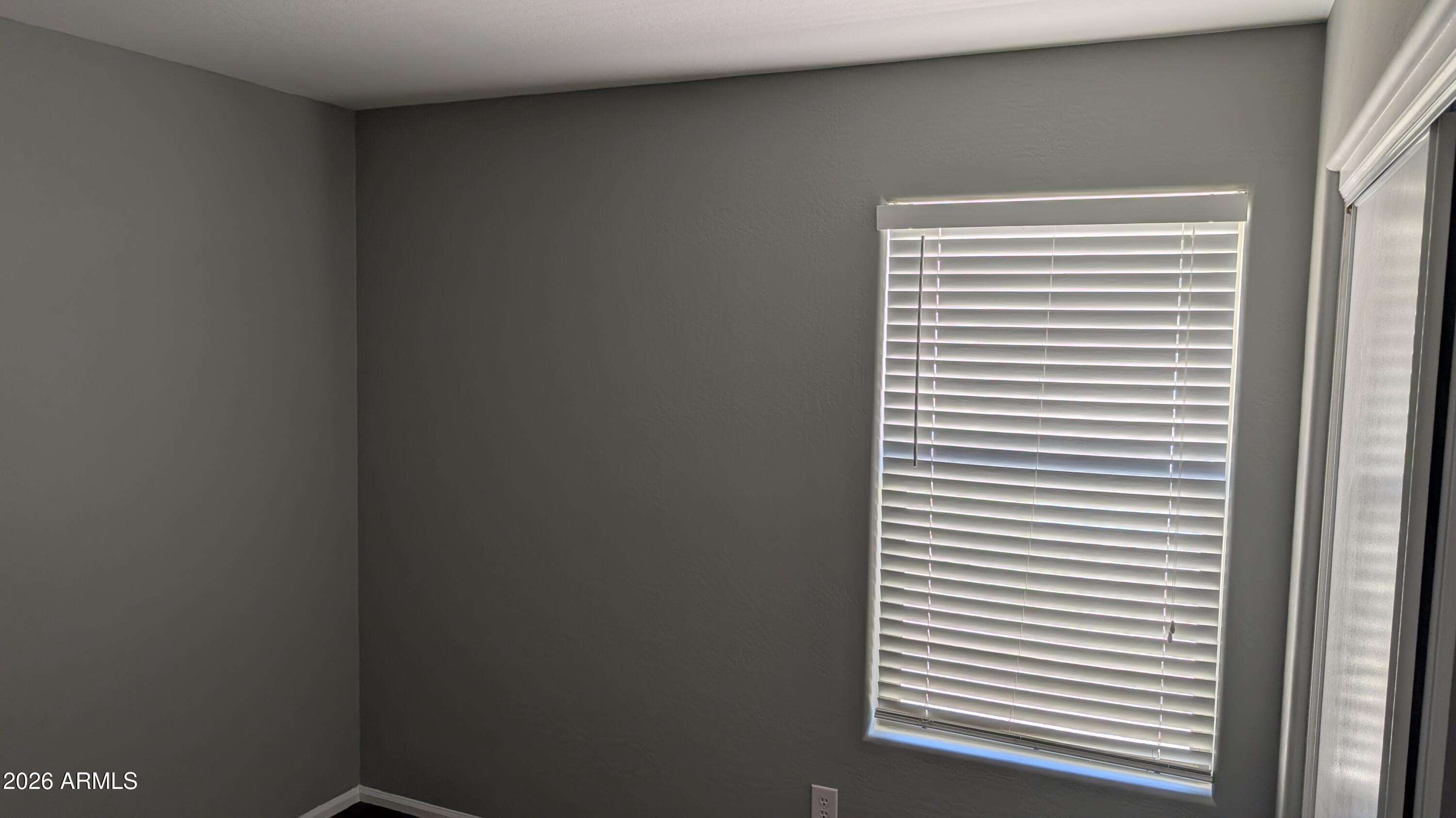 1377 East Pryor Road San Tan Valley, AZ 85140 - Photo 25 of 31 a view of a bedroom with a window