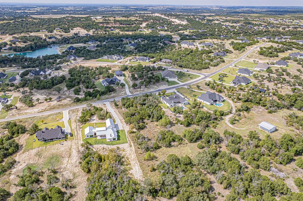 Lot 330 Sweeney Way Weatherford, TX 76087 - Photo 3 of 21 Aerial view of property and surrounding area featuring nearby suburban area and a large body of water