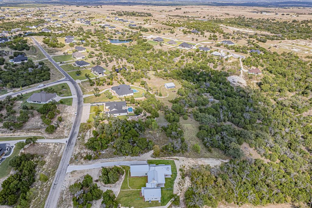 Lot 330 Sweeney Way Weatherford, TX 76087 - Photo 6 of 21 Aerial overview of property's location with nearby suburban area and a nearby body of water