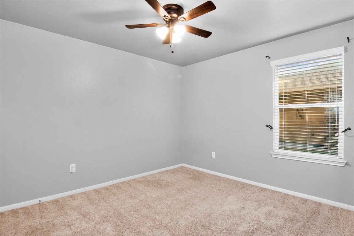 704 Red Tails Drive Austin, TX 78725 - Photo 15 of 37 a view of an empty room with a window