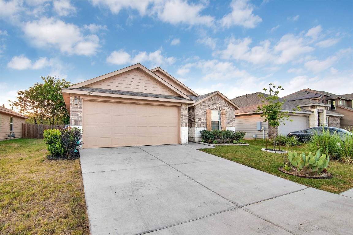 704 Red Tails Drive Austin, TX 78725 - Photo 2 of 37 a view of house and outdoor space