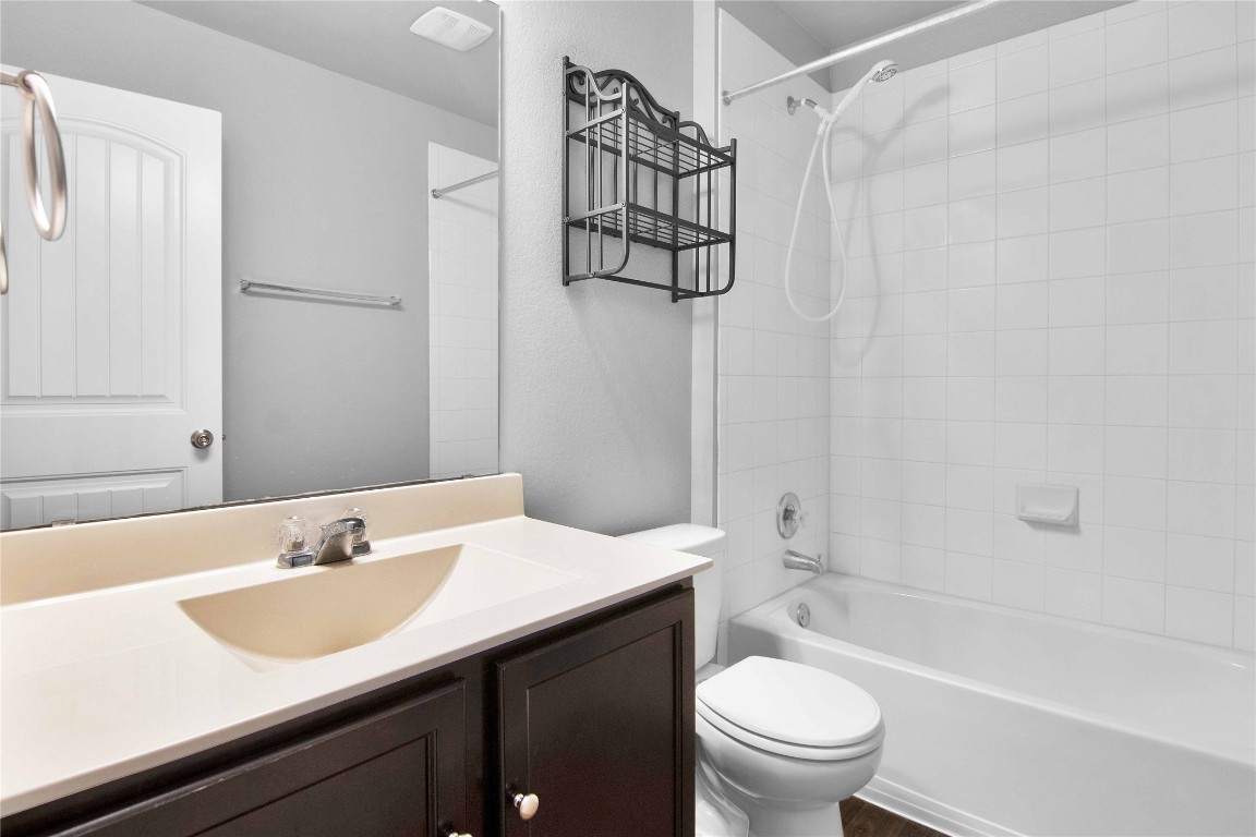 704 Red Tails Drive Austin, TX 78725 - Photo 21 of 37 a bathroom with a sink toilet and shower