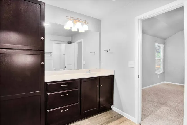 a bathroom with a double vanity sink and mirror