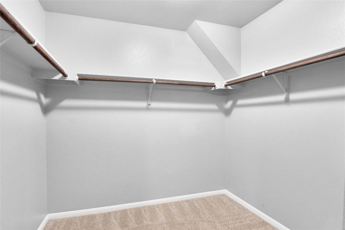 704 Red Tails Drive Austin, TX 78725 - Photo 26 of 37 a view of an empty walk in closet