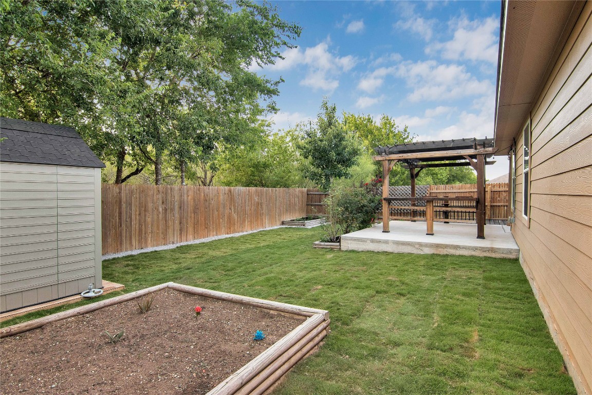 704 Red Tails Drive Austin, TX 78725 - Photo 31 of 37 a view of backyard with a small cabin