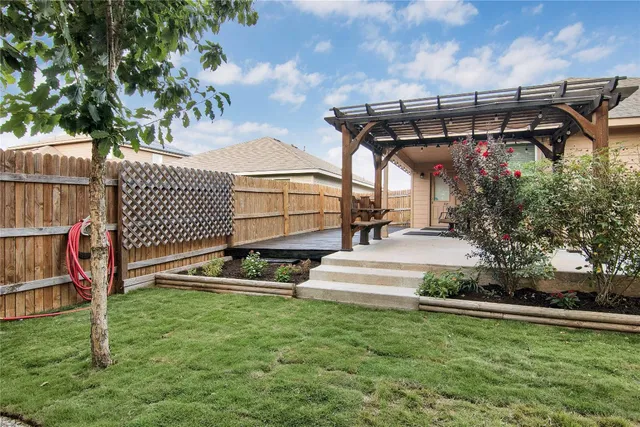 a view of backyard with a small cabin