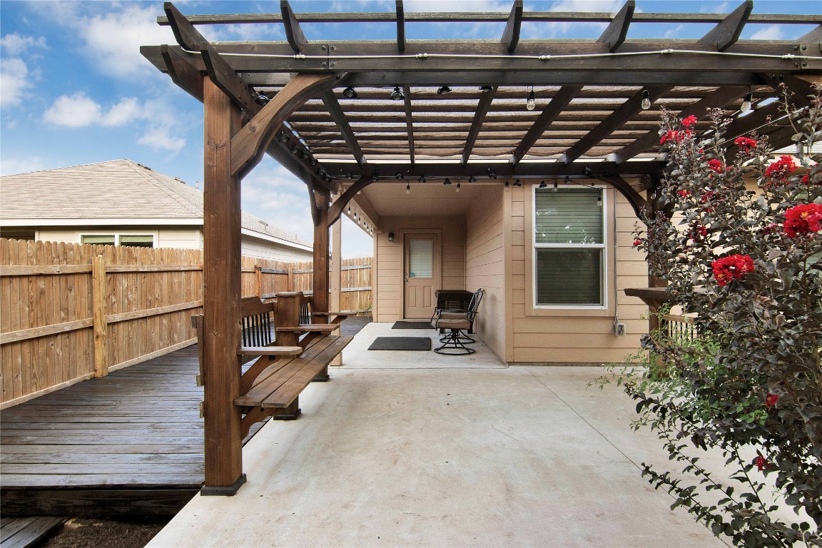 704 Red Tails Drive Austin, TX 78725 - Photo 36 of 37 a view of a patio with table and chairs and potted plants