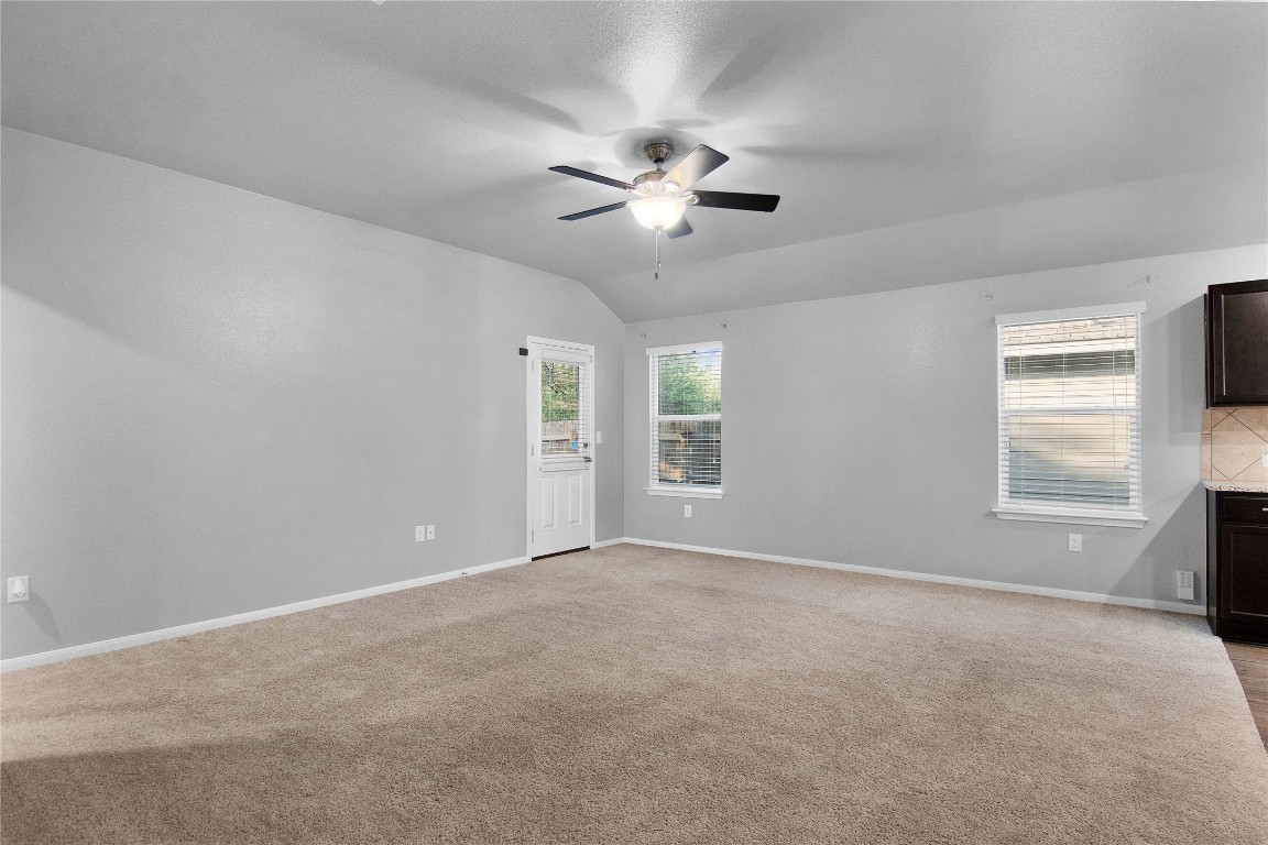704 Red Tails Drive Austin, TX 78725 - Photo 7 of 37 a view of an empty room with a window