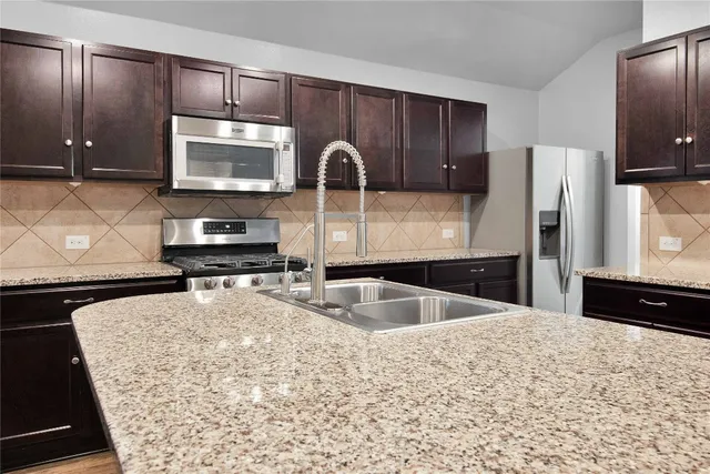 a kitchen with a sink and a cabinets