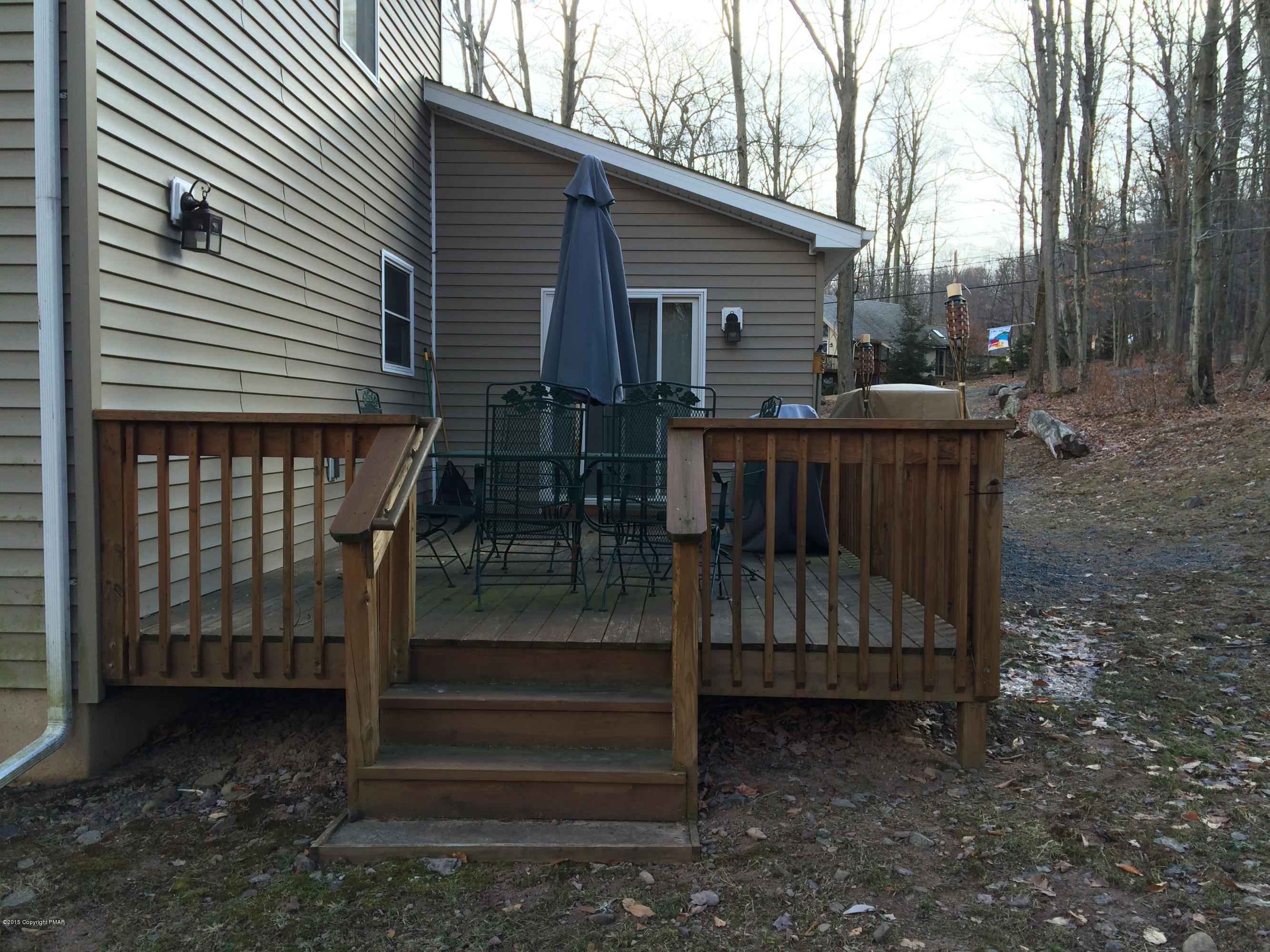 310 Fawn Road Pocono Lake, PA 18347 - Photo 2 of 26 a view of backyard with deck and wooden floor