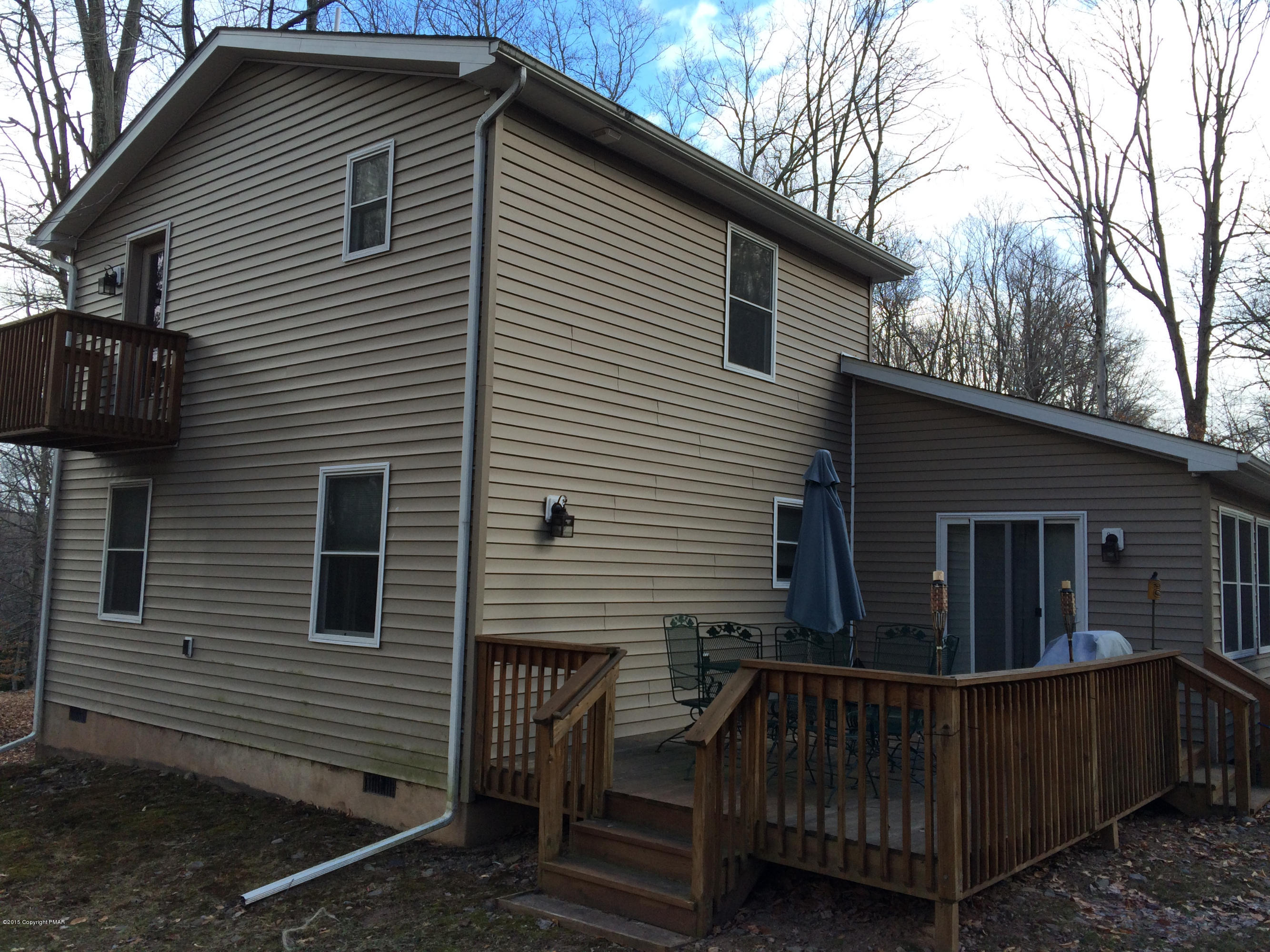 310 Fawn Road Pocono Lake, PA 18347 - Photo 3 of 26 a view of house with backyard and outdoor seating