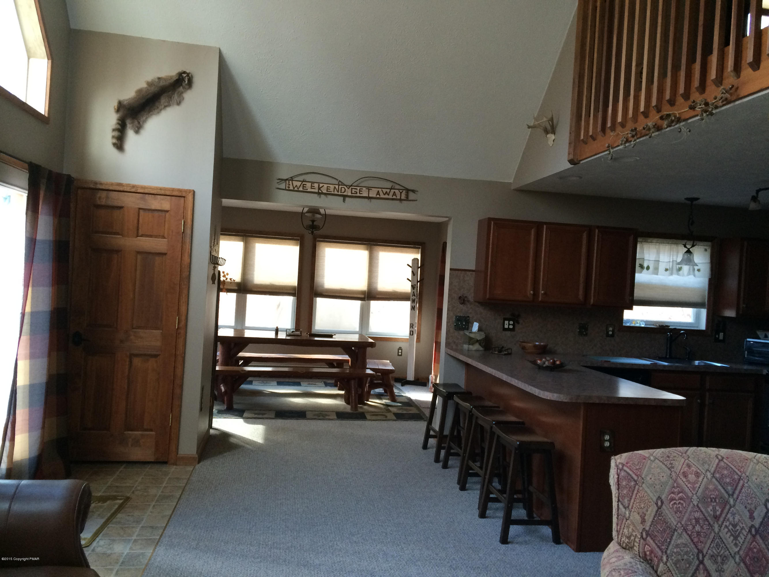 310 Fawn Road Pocono Lake, PA 18347 - Photo 6 of 26 a kitchen with a sink and a refrigerator