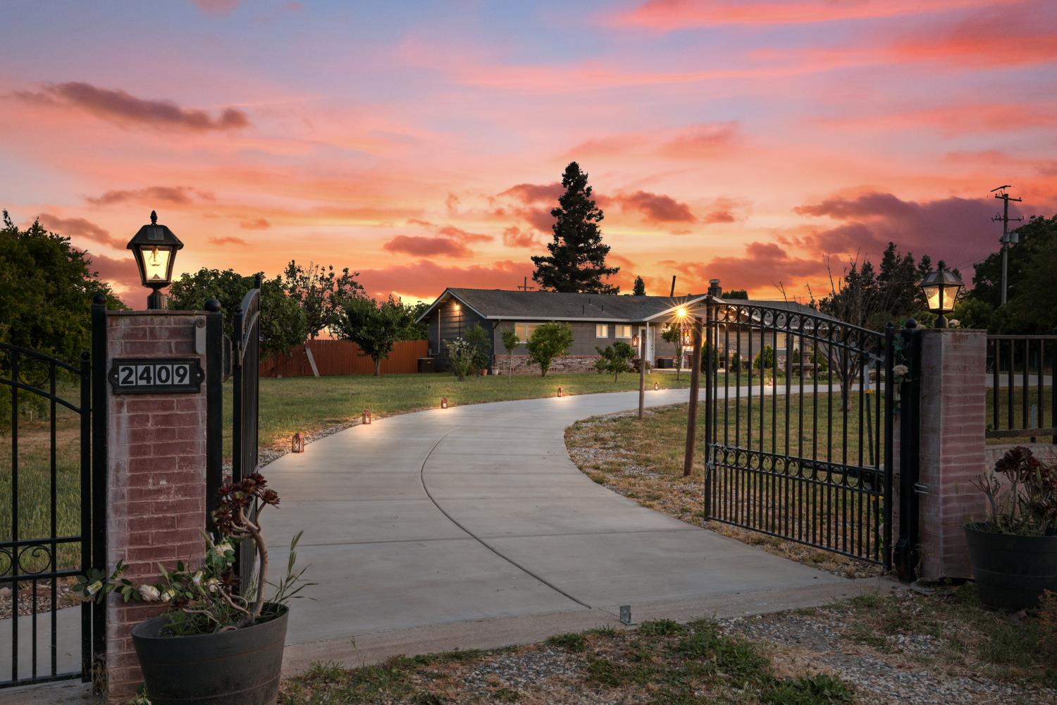 a view of a street with a fountain in the background