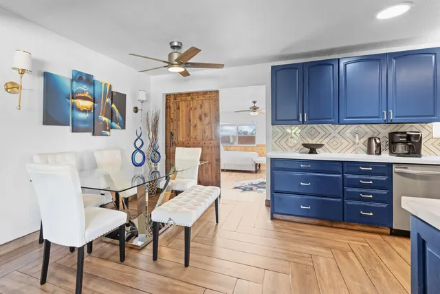 a kitchen with stainless steel appliances granite countertop a refrigerator stove and sink