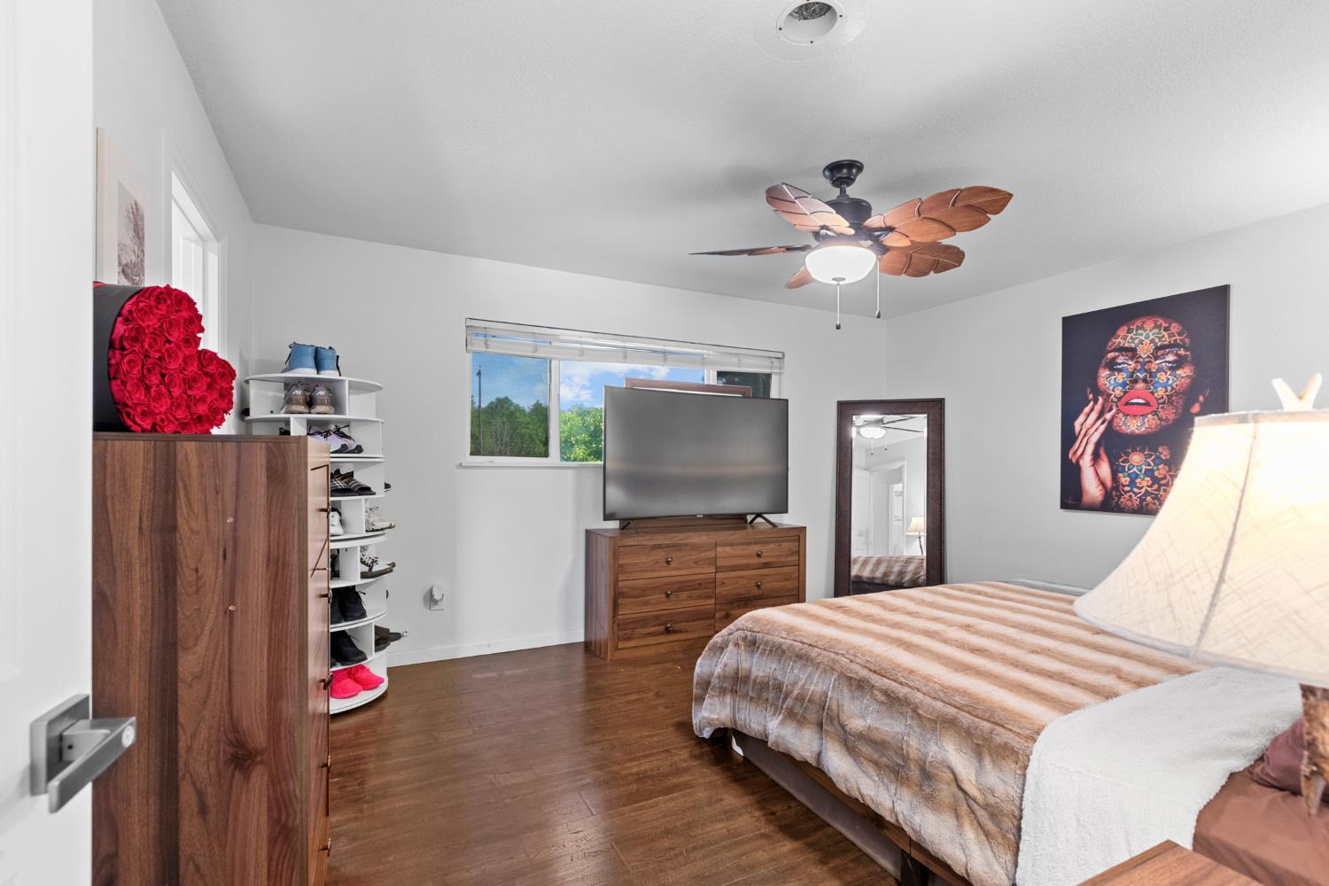 2409 Rio Oso Road Rio Oso, CA 95674 - Photo 24 of 67 a bedroom with a bed and a chandelier