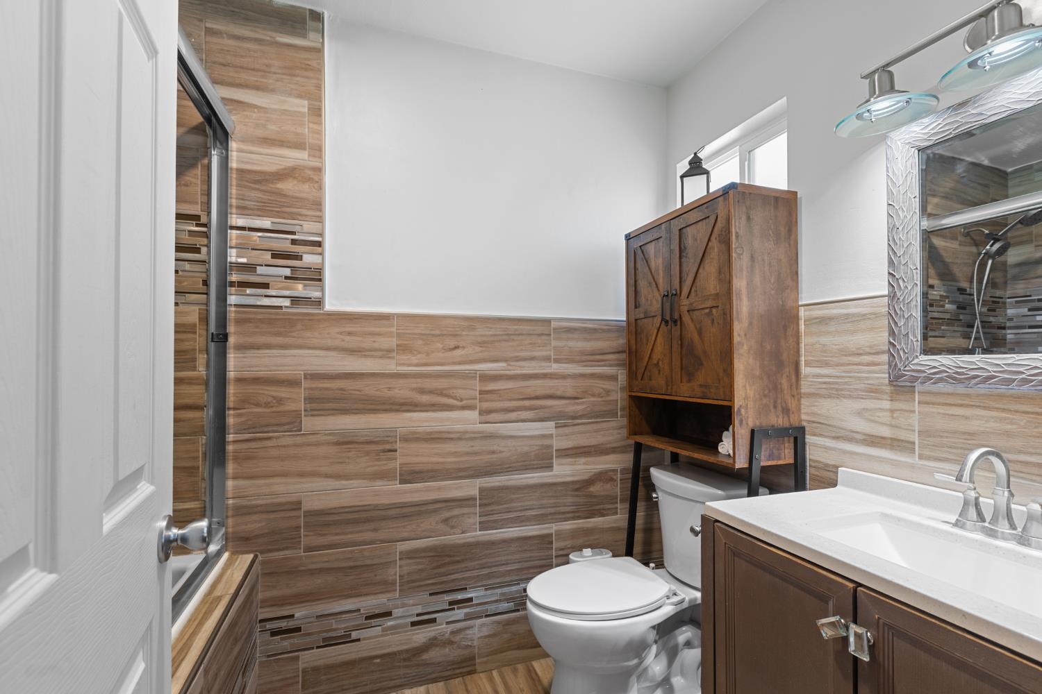 2409 Rio Oso Road Rio Oso, CA 95674 - Photo 25 of 67 a bathroom with a toilet sink and mirror