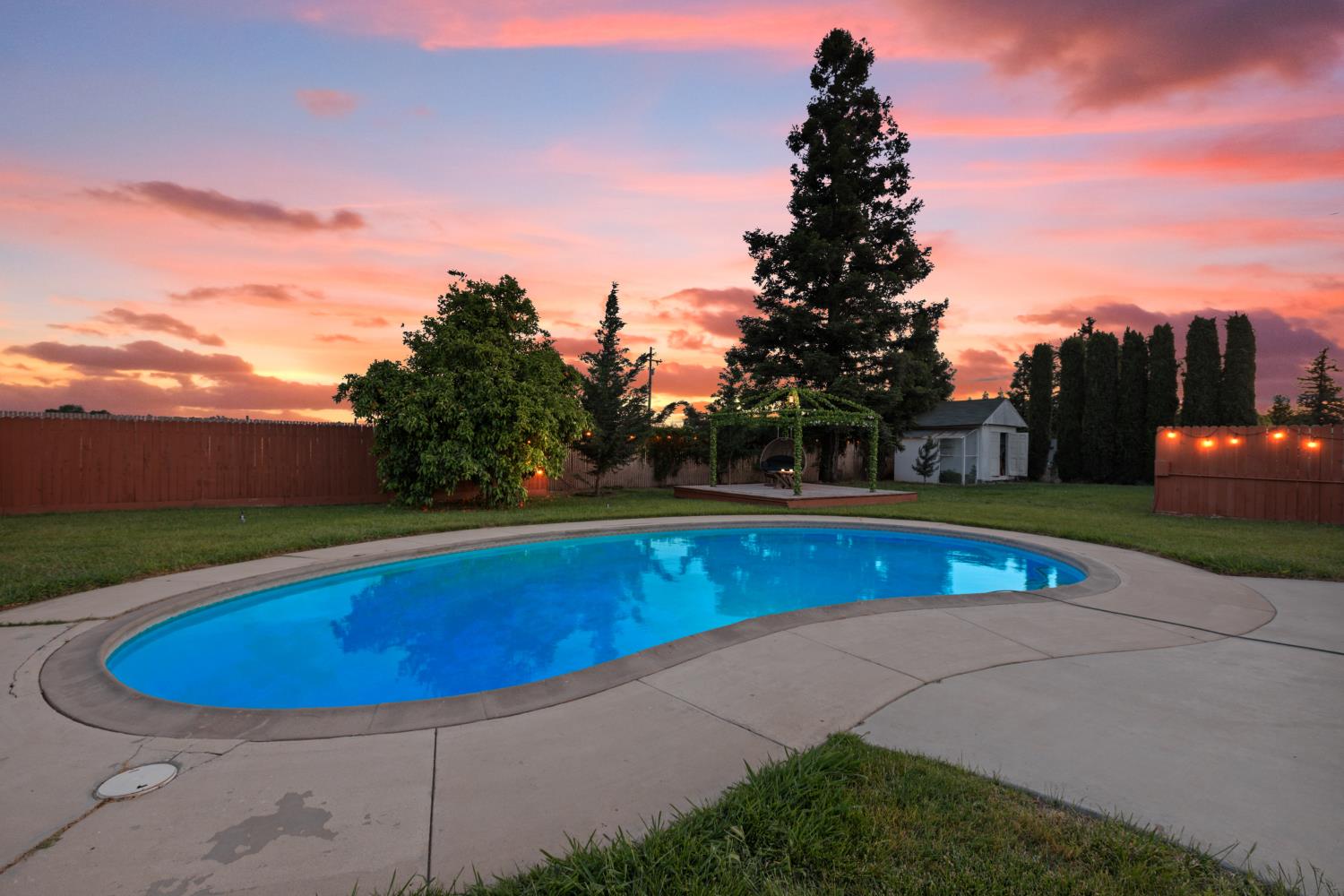 2409 Rio Oso Road Rio Oso, CA 95674 - Photo 3 of 67 a view of a swimming pool with an outdoor seating and a garden