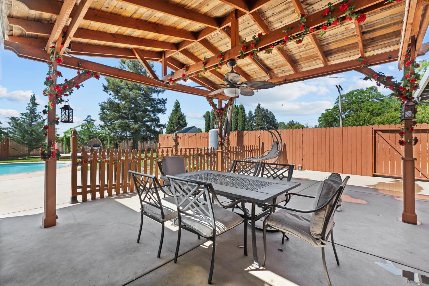 2409 Rio Oso Road Rio Oso, CA 95674 - Photo 31 of 67 a view of patio with table and chairs and wooden fence