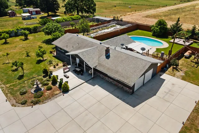 a building outdoor space with patio furniture and potted plants