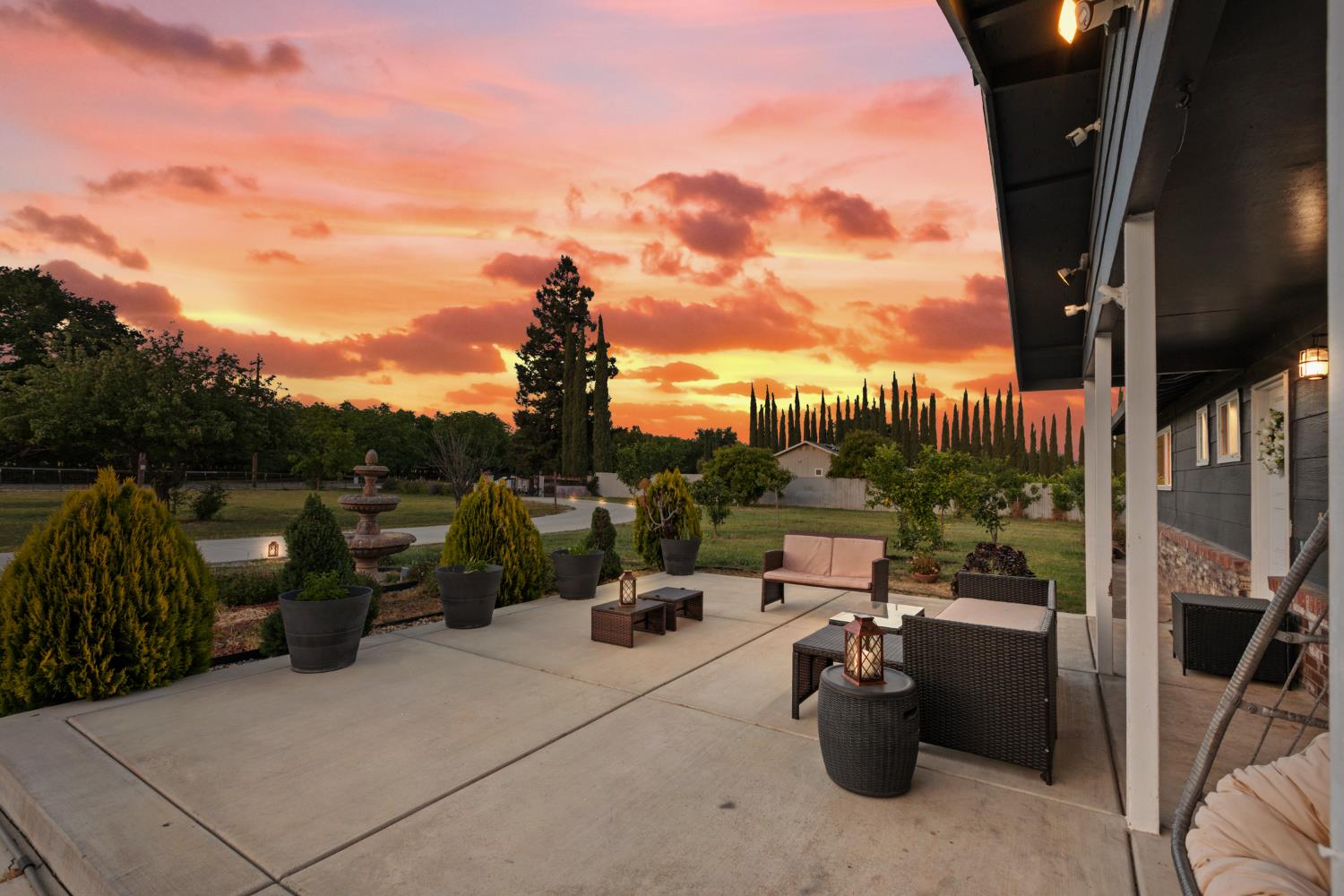 2409 Rio Oso Road Rio Oso, CA 95674 - Photo 4 of 67 a view of a patio with couches chairs and potted plants