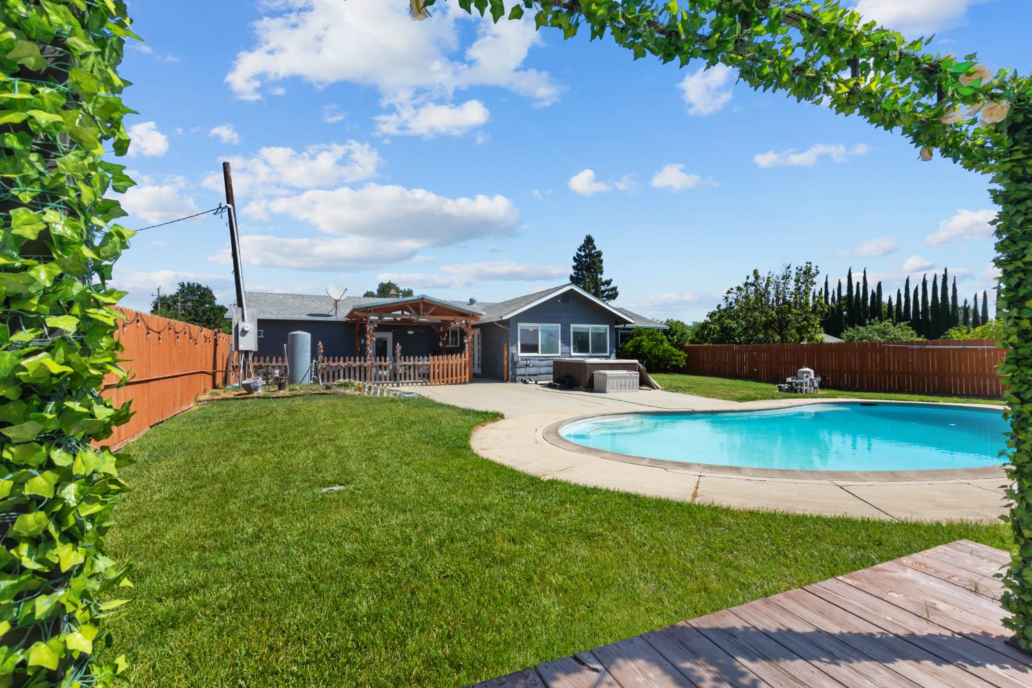 2409 Rio Oso Road Rio Oso, CA 95674 - Photo 41 of 67 a front view of a house with swimming pool having outdoor seating