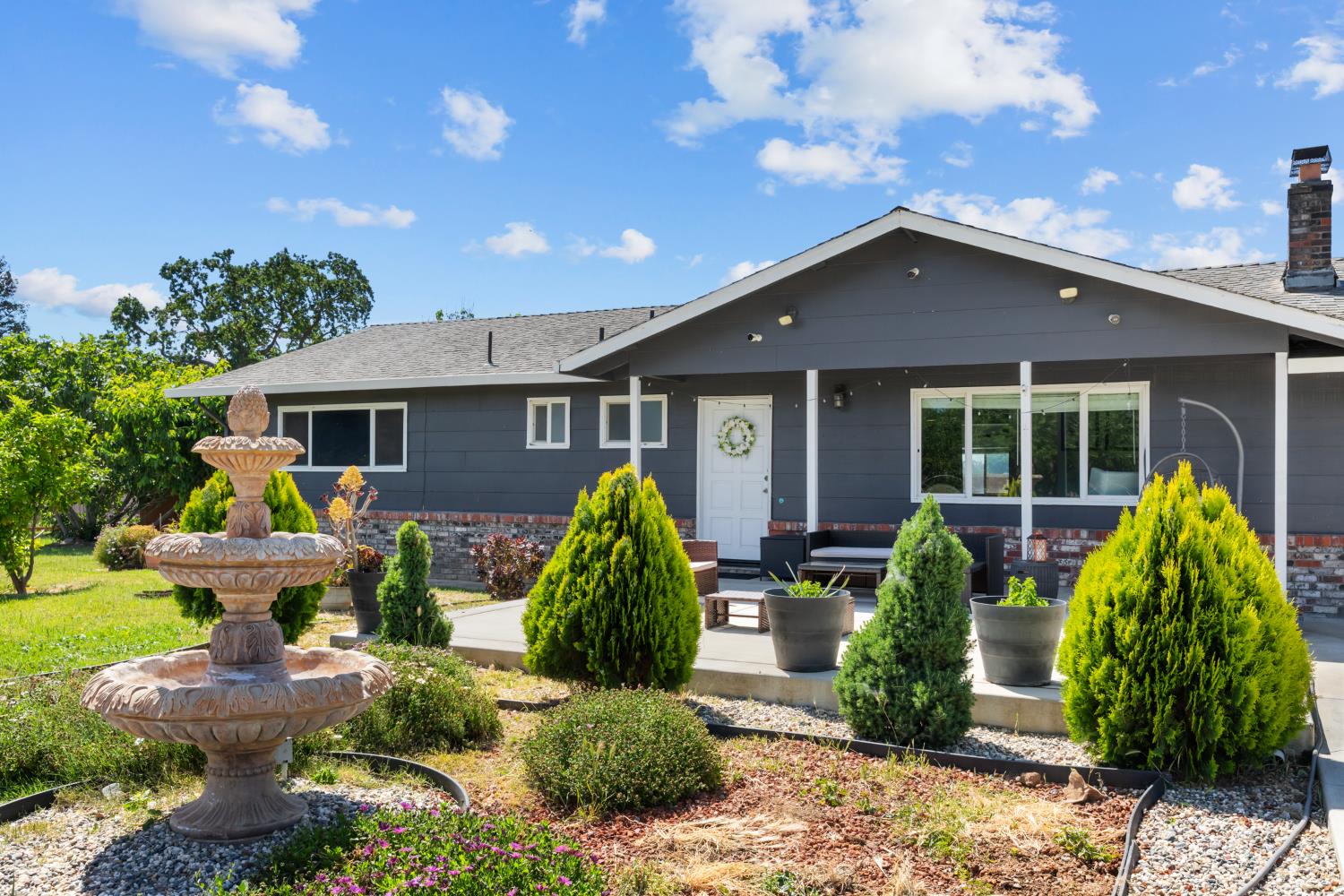 2409 Rio Oso Road Rio Oso, CA 95674 - Photo 54 of 67 a front view of house with yard and outdoor seating