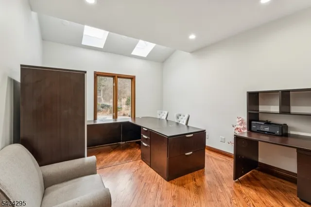 a bathroom with a sink a mirror and a shower